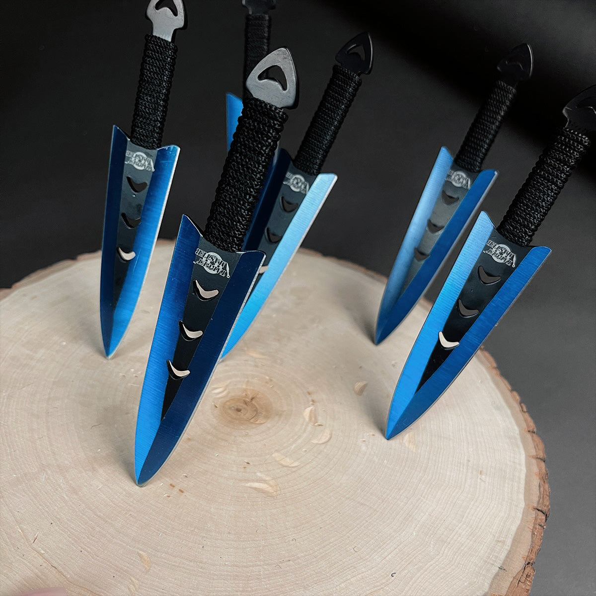 Falcon 6 PC Blue Throwing Knives Set stylishly displayed on a wooden surface