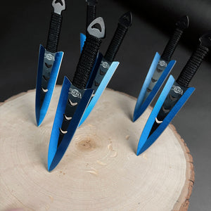 Falcon 6 PC Blue Throwing Knives Set stylishly displayed on a wooden surface