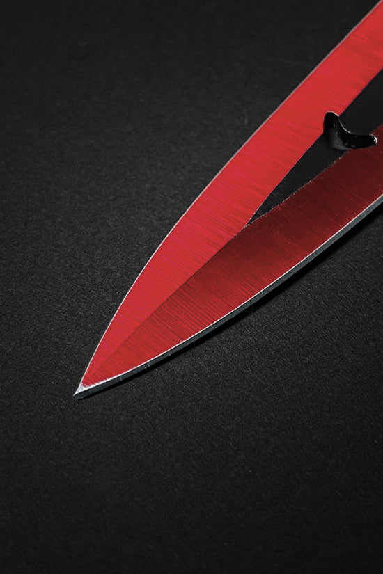 Close-up of Falcon 6 PCS Red Throwing Knives Set highlighting sharp blades and precision design