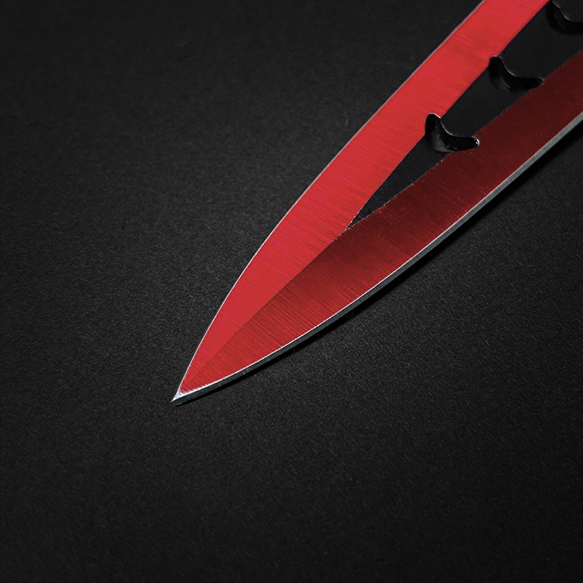 Close-up of Falcon 6 PCS Red Throwing Knives Set highlighting sharp blades and precision design