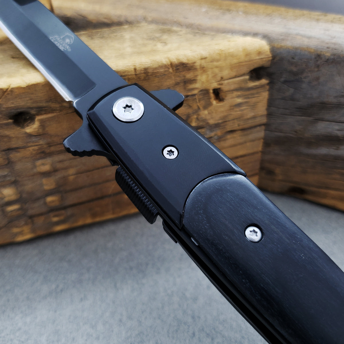 Falcon 8 3/4" Black Spring Assisted Stiletto Knife with sleek handle and sharp blade design