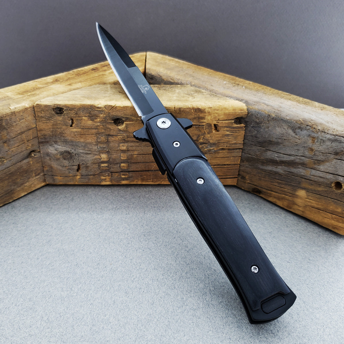 Falcon 8 3/4" Black Spring Assisted Stiletto Knife with sleek black handle and sharp blade