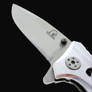 Close-up of Falcon EDC knife wood handle spring assisted pocket knife blade and logo