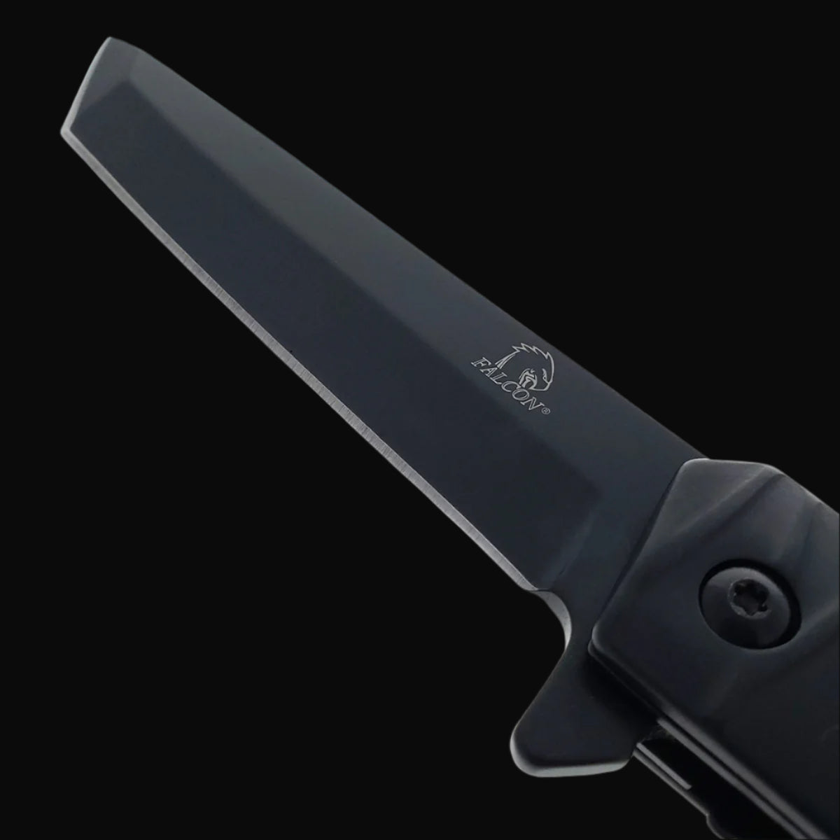 Closeup of Falcon tanto spring assisted pocket knife black tanto blade with Falcon logo on blade and handle