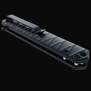 Black folded Falcon tanto spring assisted pocket knife . Closed textured handle with deep pocket clip for everyday carry