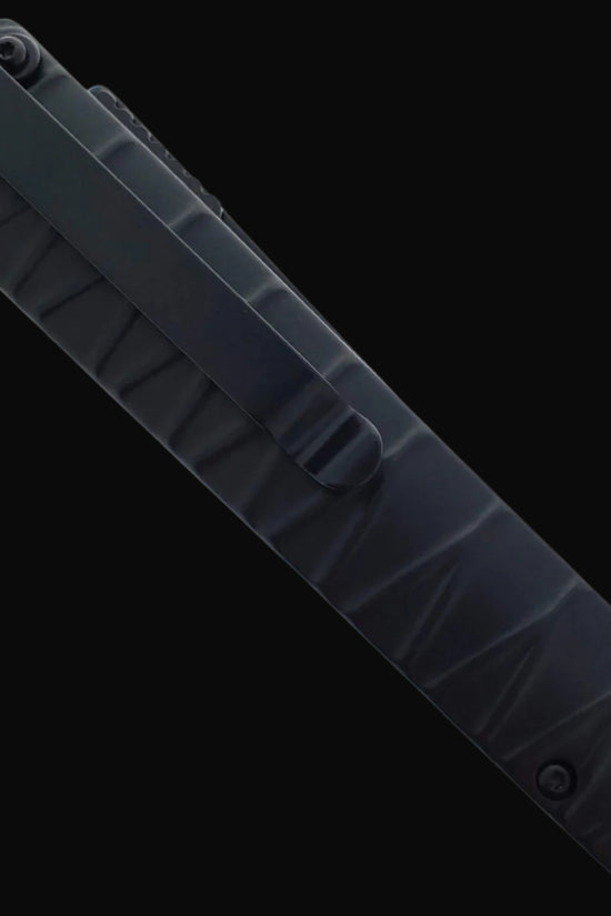 Closed Falcon tanto spring assisted pocket knife . Black textured handle with pocket clip and lanyard hole for everyday carry