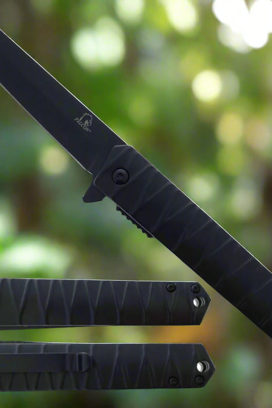 Black Falcon tanto spring assisted pocket knife . with textured black handle, flipper tab and pocket clip shown open and closed
