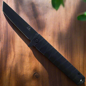 Black Falcon tanto spring assisted pocket knife . Black tanto blade open with textured black handle EDC