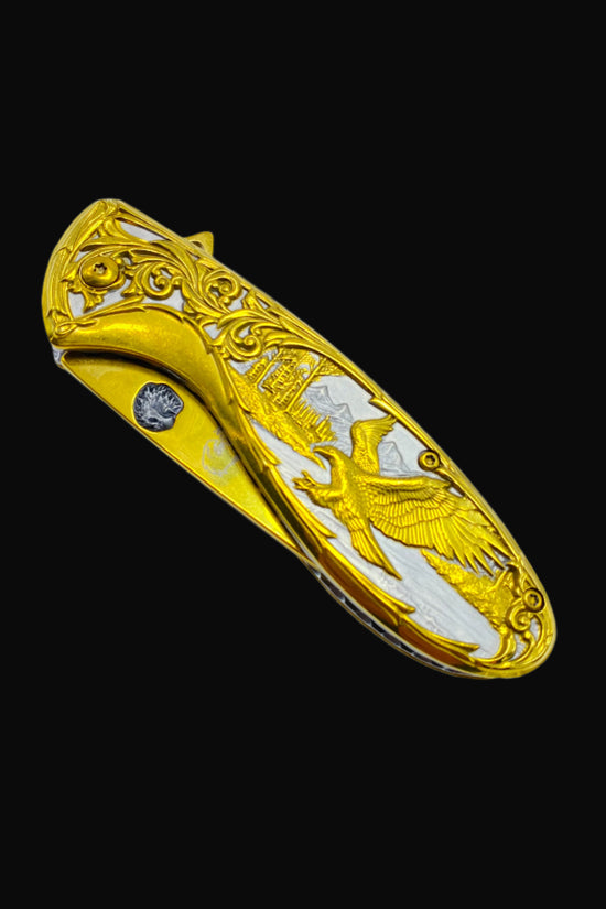Falcon gold spring assisted knife pocket knife with detailed eagle and scroll design closed blade