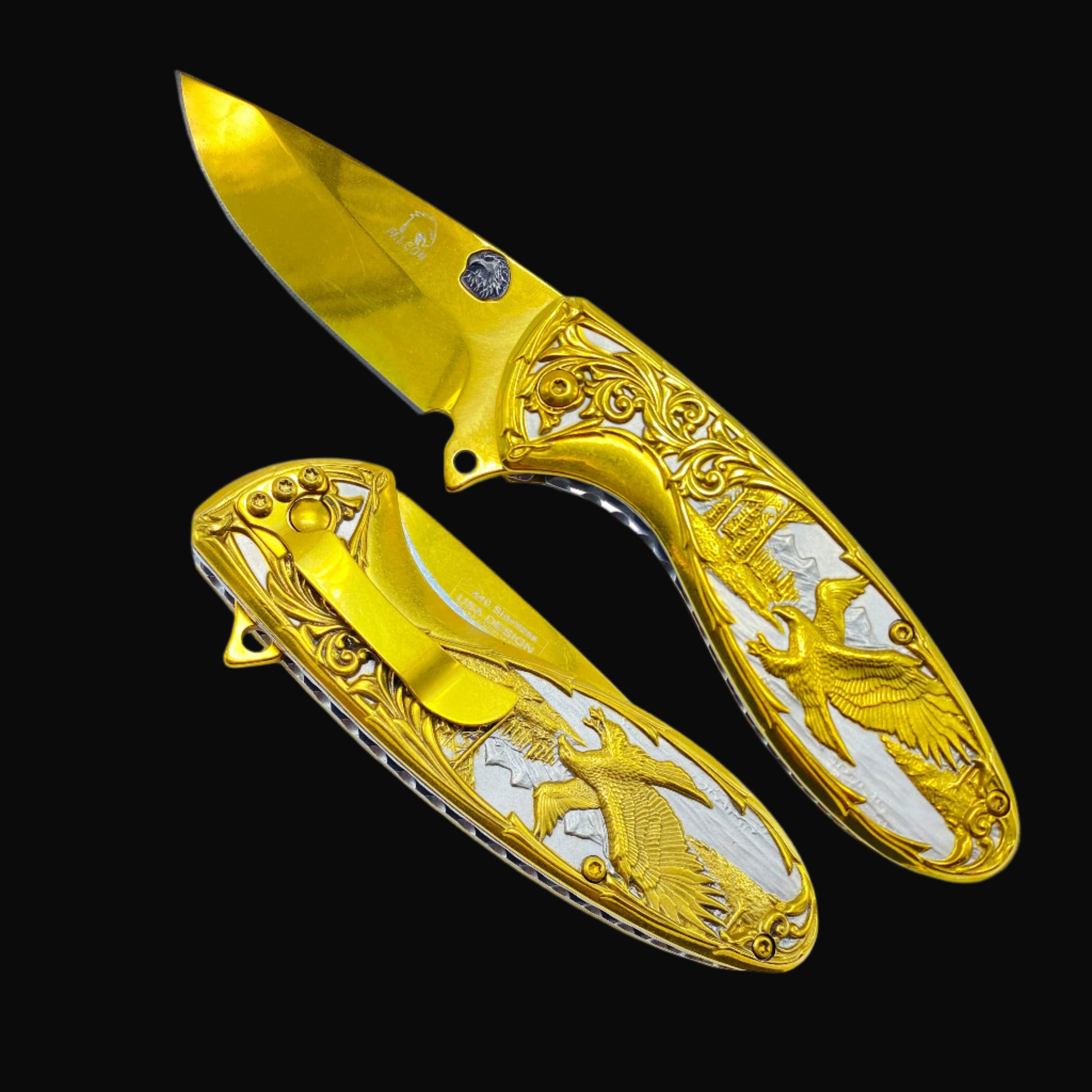 Falcon gold spring assisted knife with ornate eagle design and decorative handle detailing