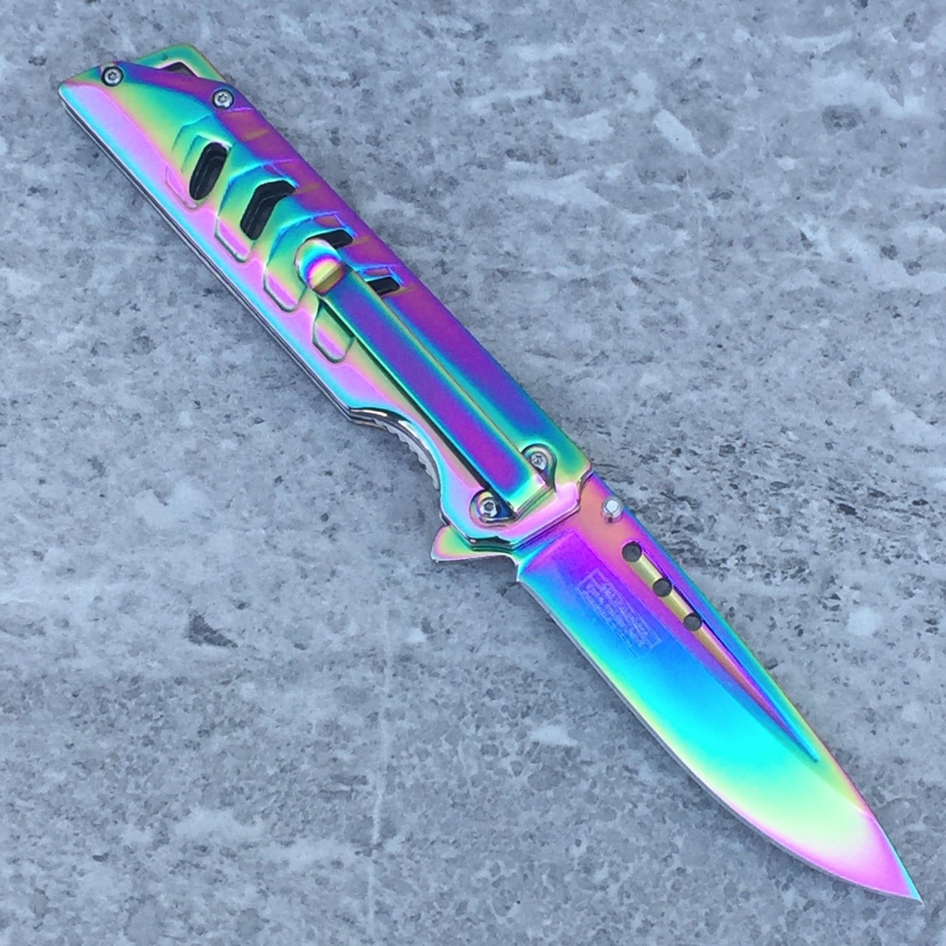 Falcon Mirror Rainbow Spring Assisted Pocket Knife with a colorful, reflective blade and ergonomic handle