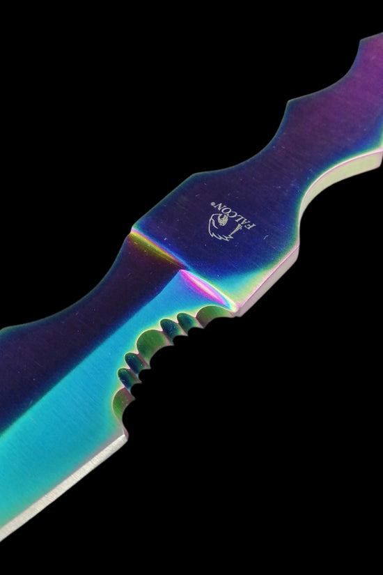 Close-up of Falcon rainbow Fixed Blade Tactical knife with iridescent metallic finish and serrated edge
