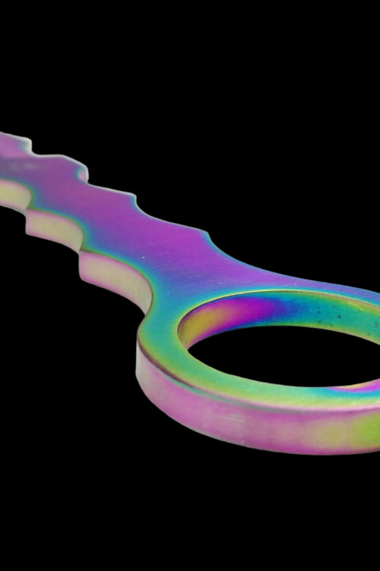 Close-up of Falcon rainbow Fixed Blade Tactical knife with iridescent finish and ergonomic ring handle