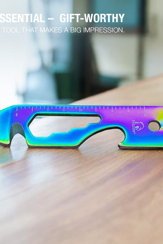 Falcon Rainbow Multi-Tool - 2.7 inch 8-in-1 multi-tool keychain in vibrant rainbow finish on wood surface