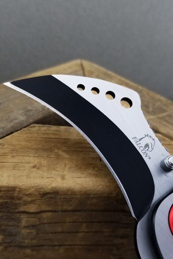 Falcon Red Karambit Spring Assisted Knife with stainless steel blade and ergonomic design