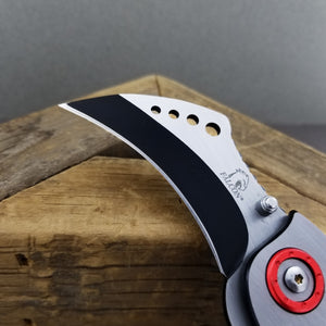 Falcon Red Karambit Spring Assisted Knife with stainless steel blade and ergonomic design
