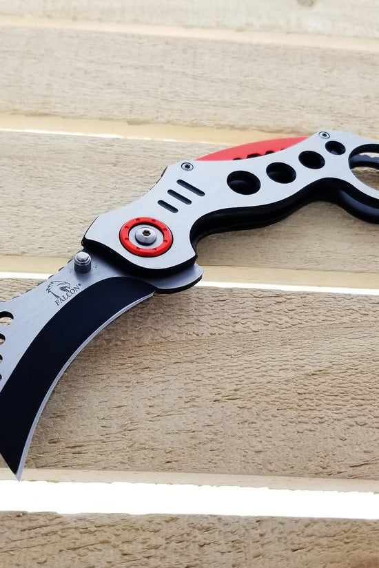 Falcon Red Karambit Spring Assisted Knife with a sleek design and black blade for easy use