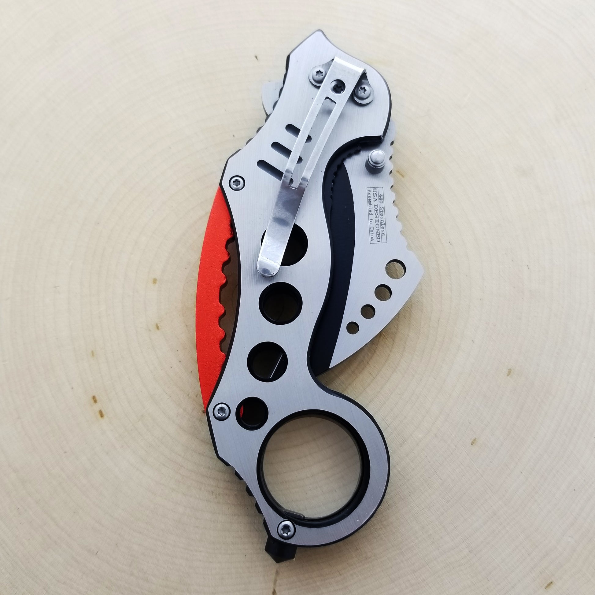 Falcon Red Karambit Spring Assisted Knife with ergonomic handle and stainless steel blade