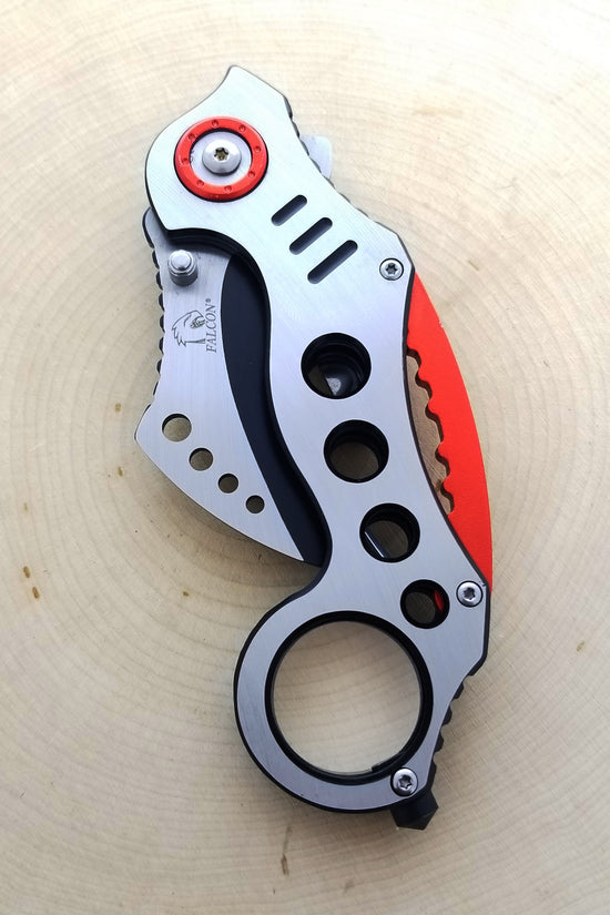 Falcon Red Karambit Spring Assisted Knife featuring a sleek design and functional grip for easy use