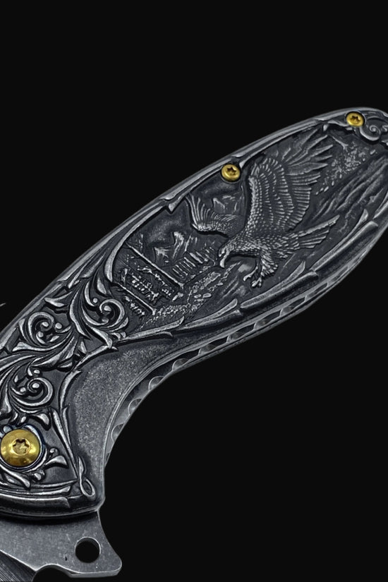 Guild Arms spring assisted falcon knife pocket knife with detailed falcon and floral engraved handle