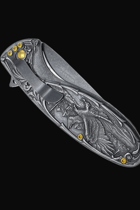 Guild Arms spring assisted falcon knife with detailed engraved falcon design on the closed pocket knife handle