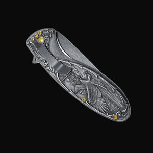 Guild Arms spring assisted falcon knife with detailed engraved falcon design on the closed pocket knife handle