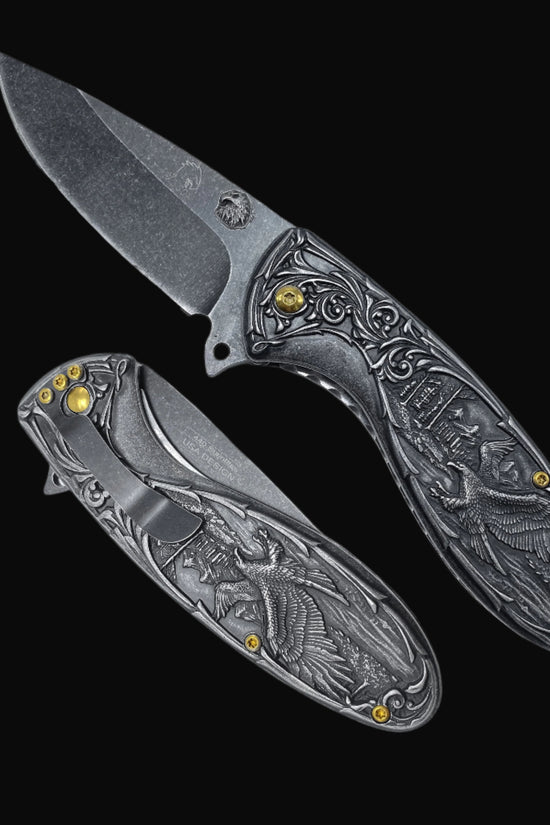 Guild Arms spring assisted falcon knife with detailed engraved handle and black stonewashed blade