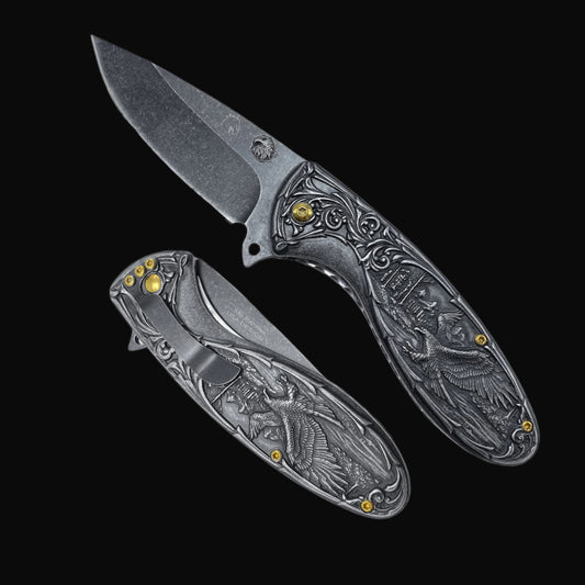 Guild Arms spring assisted falcon knife with detailed engraved handle and black stonewashed blade