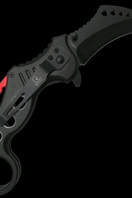 Falcon spring assisted karambit knife with black curved blade and ergonomic handle