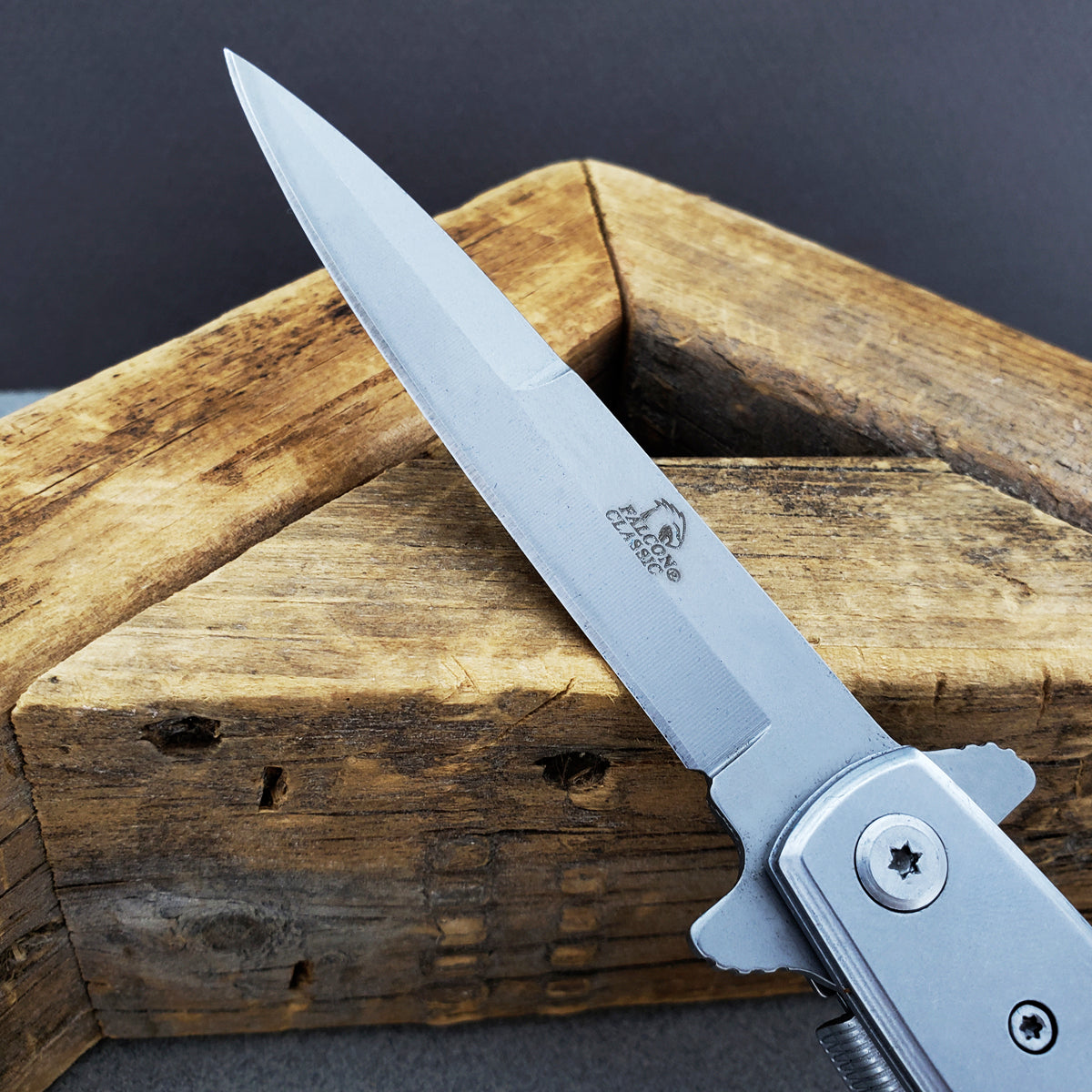 Falcon White Spring Assisted Pocket Knife with a sleek blade and ergonomic handle for easy use