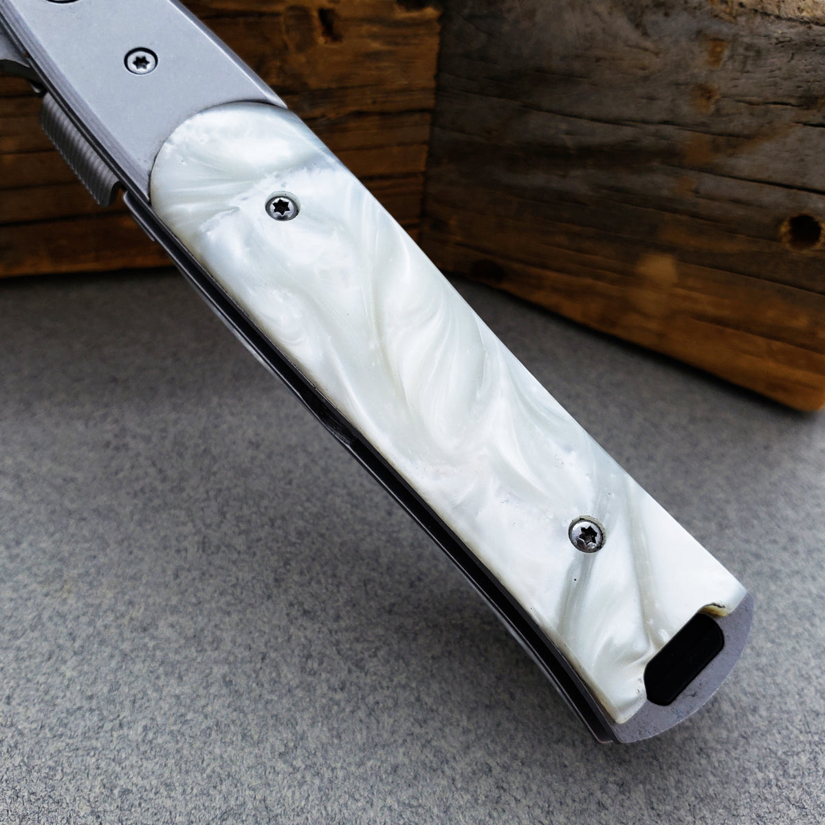 Falcon White Spring Assisted Pocket Knife with elegant white handle design and durable blade