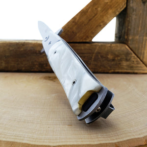 Falcon White Spring Assisted Pocket Knife with a sleek design and durable handle