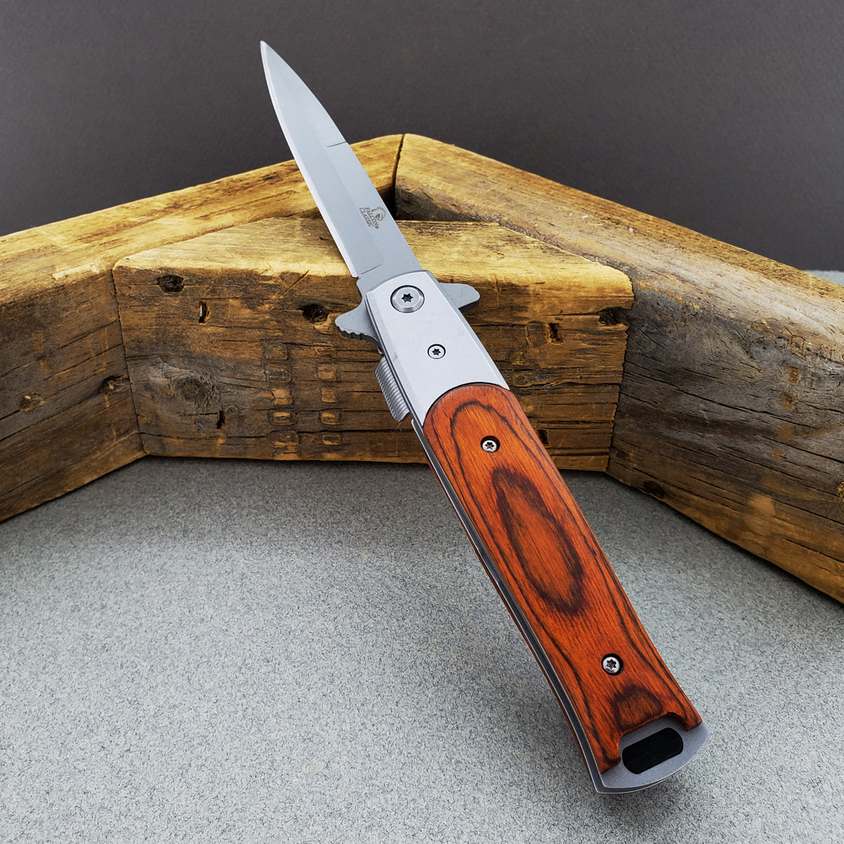 Falcon Wood Spring Assisted Pocket Knife with a sleek stainless steel blade and elegant wood handle