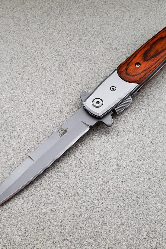 Falcon Wood Spring Assisted Pocket Knife featuring a sleek stainless steel blade and wooden handle