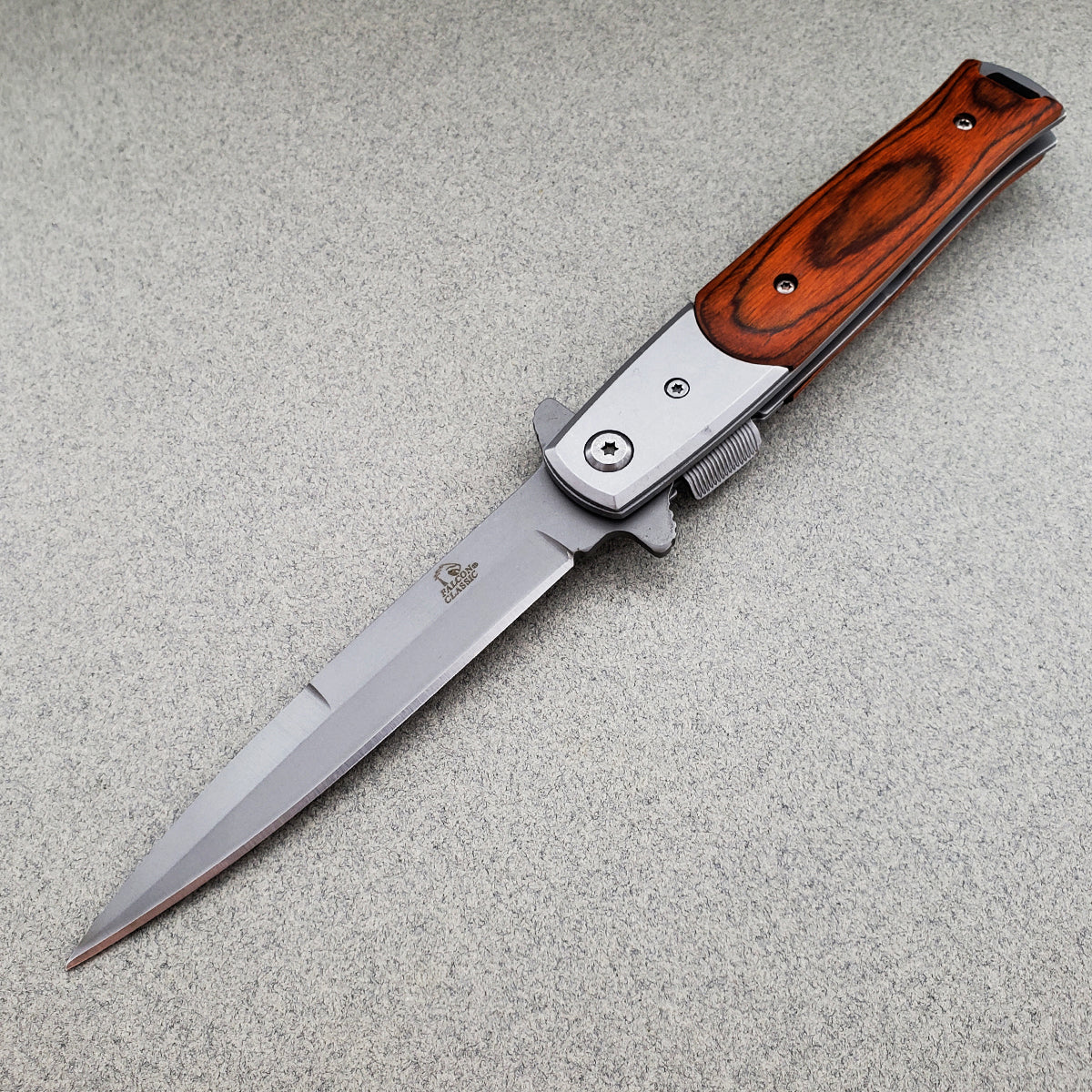 Falcon Wood Spring Assisted Pocket Knife featuring a sleek stainless steel blade and wooden handle