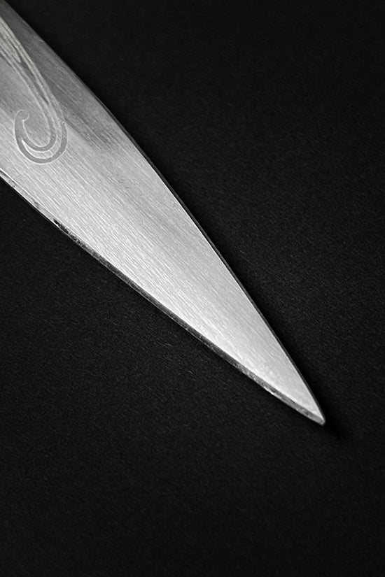 Close-up of a sharp steel blade tip of a fantasy dagger for sale by Guild Arms