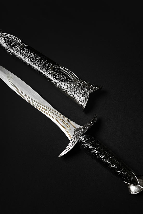 Guild Arms fantasy dagger for sale with engraved blade and ornate black and silver handle