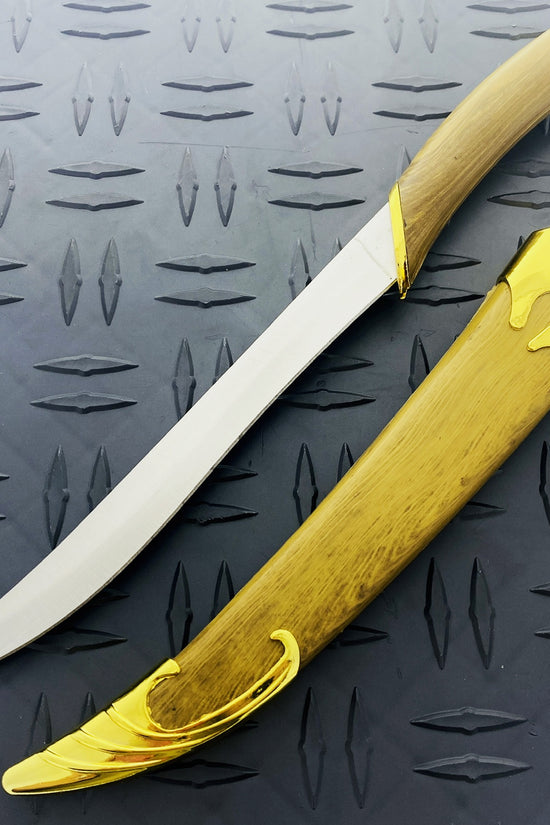 Guild Arms Fantasy Elvish Dagger with a curved blade and ornate gold accents on the handle
