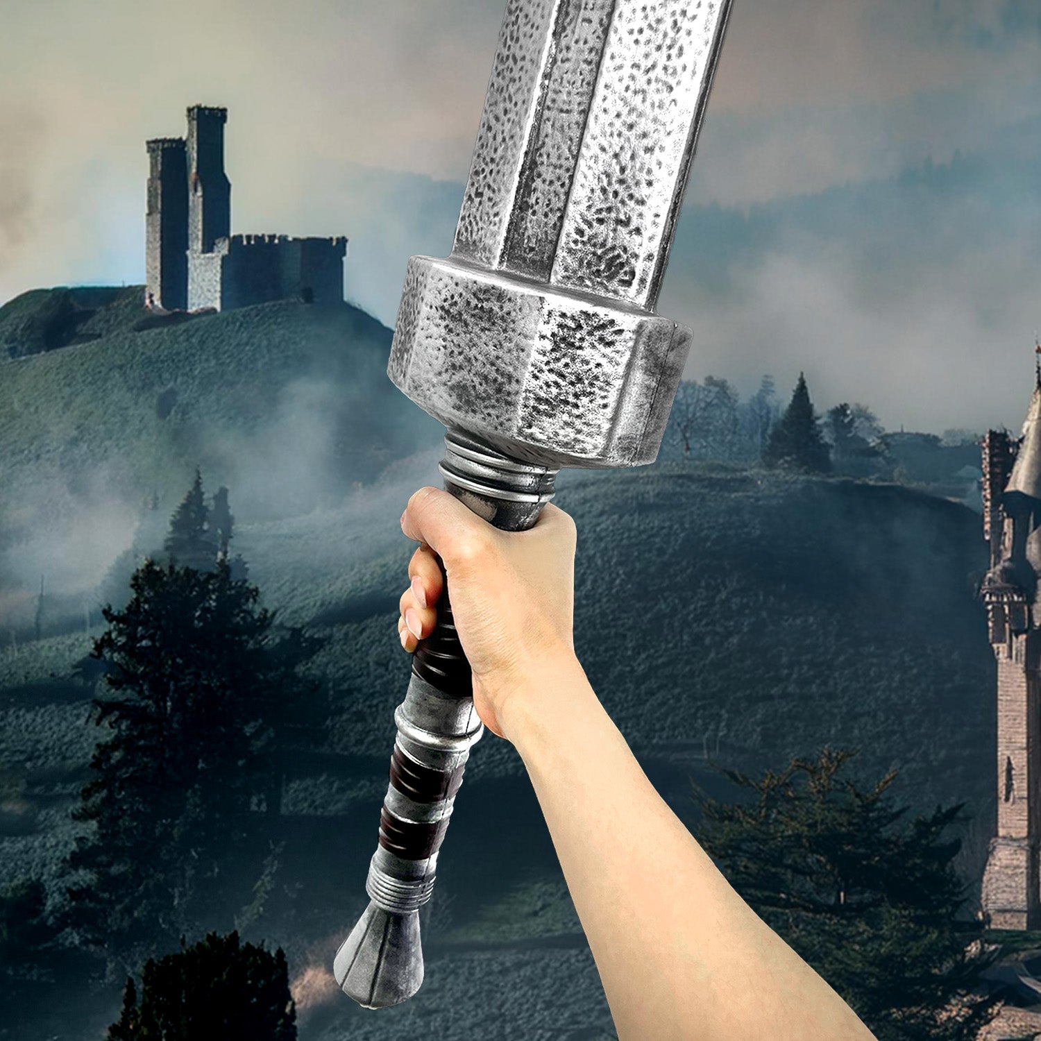 Guild Arms Foam Elden Sword held in hand against a castle backdrop for fantasy play