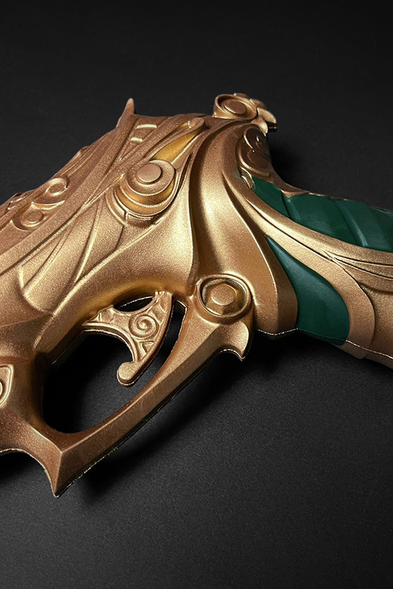 Otaku Gear ornate gold and green foam fantasy gun prop close up showing carved details and ergonomic grip