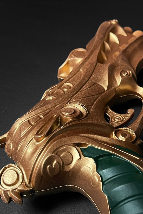 Otaku Gear foam fantasy gun prop in bronze ornate design with green grip and carved fantasy details