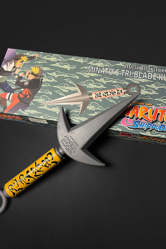 Otaku Gears foam flying thunder kunai with yellow handle and  packaging on black background