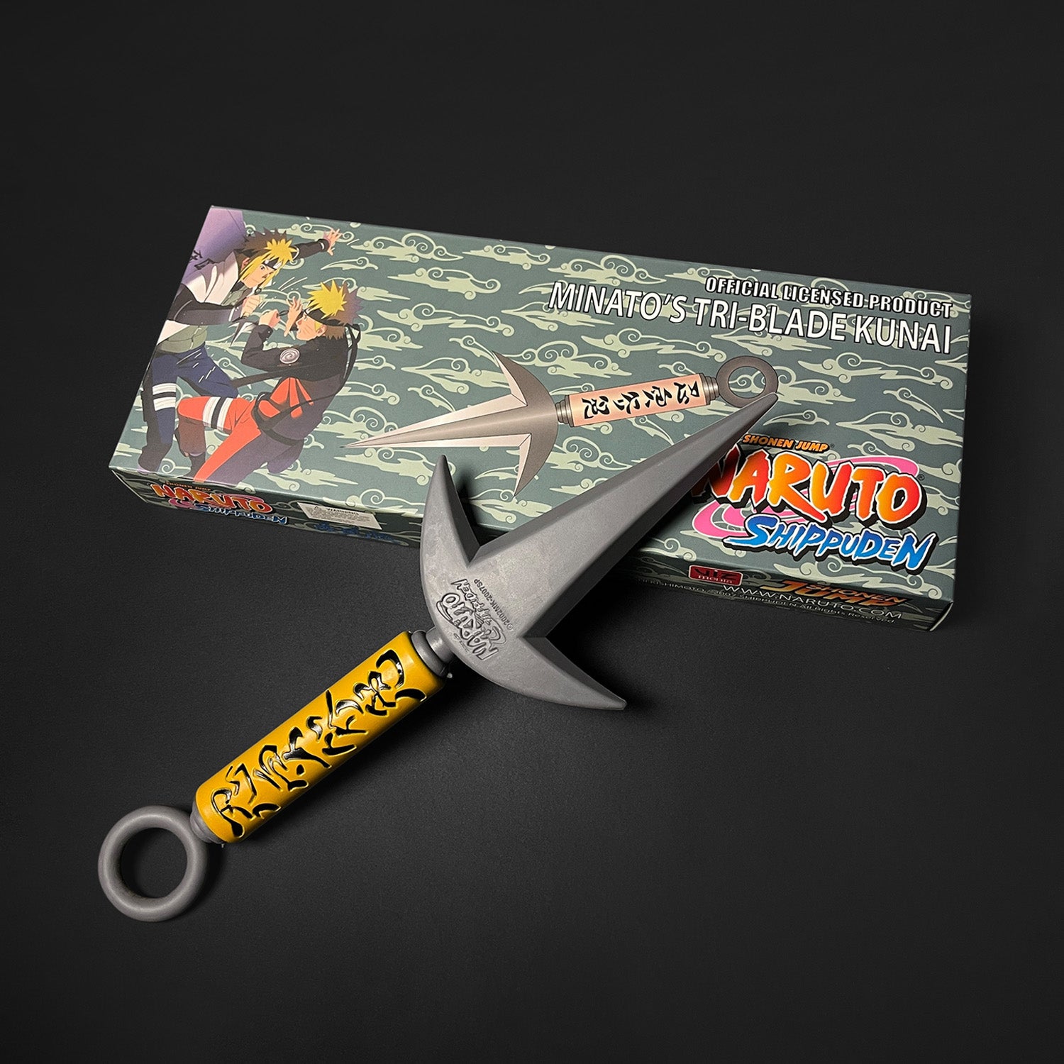 Otaku Gears foam flying thunder kunai with yellow handle and  packaging on black background