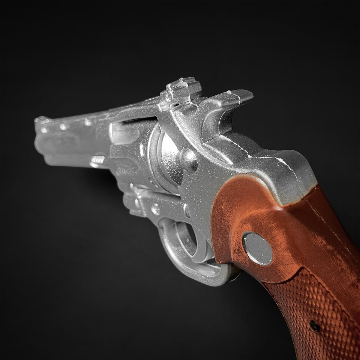 Guild Arms silver anime foam revolver with brown grip on black background foam revolver prop for cosplay