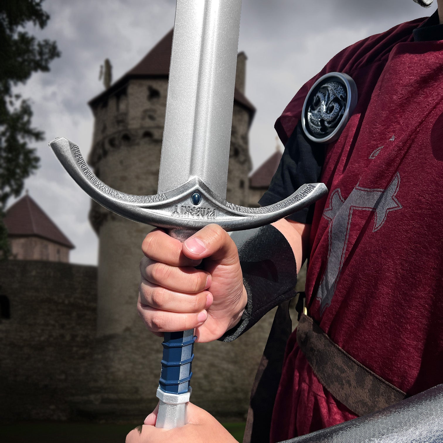 Guild Arms foam Ring Medieval sword held by a person in a tunic near a castle backdrop