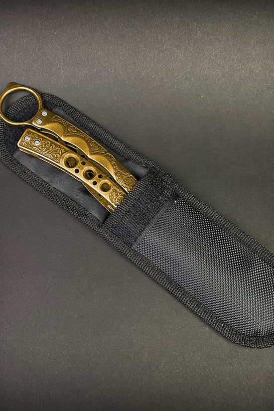 Guild Arms gold butterfly trainer knife with decorative handle in black protective nylon sheath