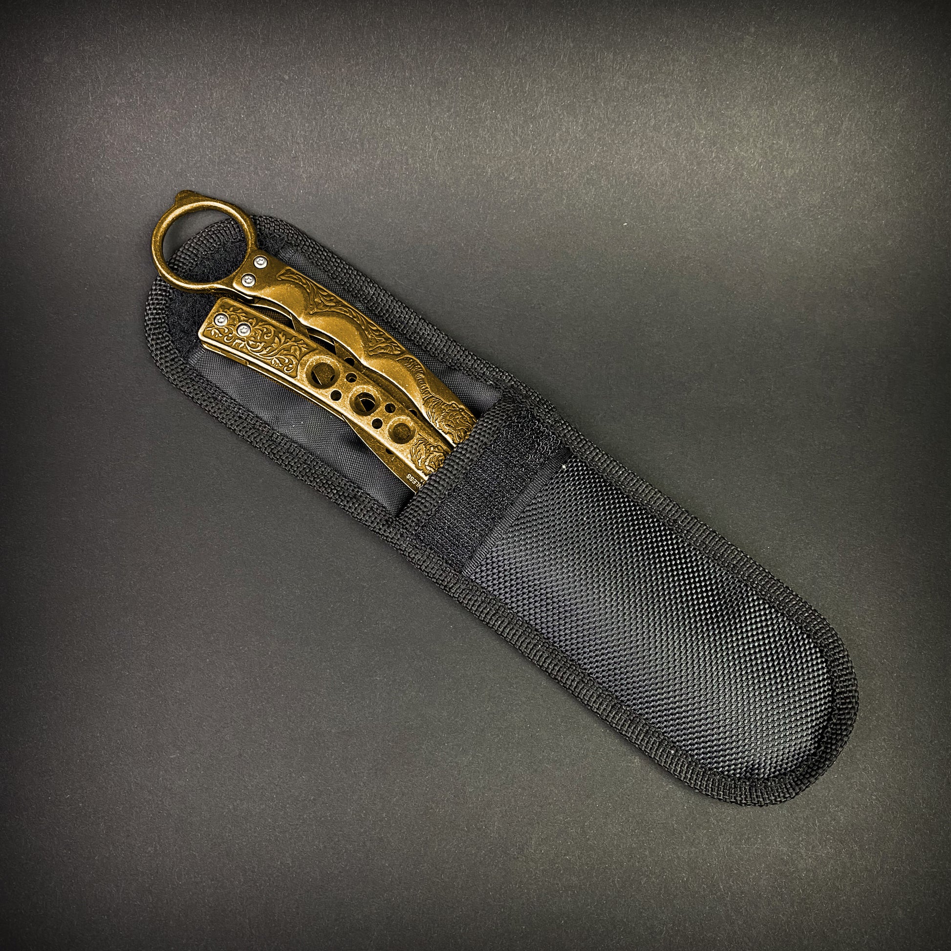 Guild Arms gold butterfly trainer knife with decorative handle in black protective nylon sheath