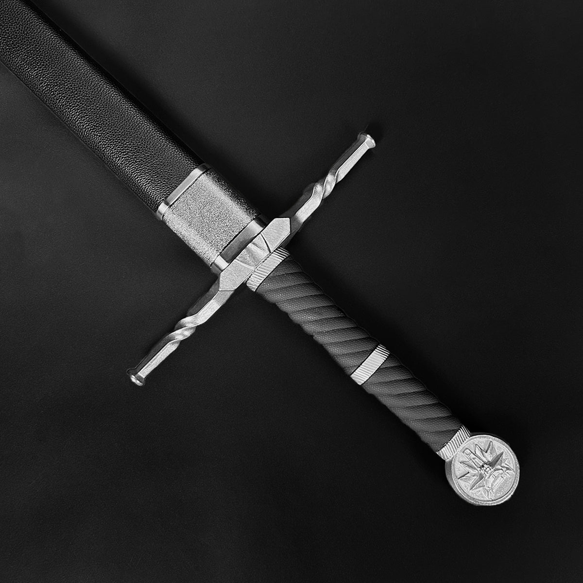 Hand-forged knight medieval sword with a detailed grip and ornate pommel from Knight Collections