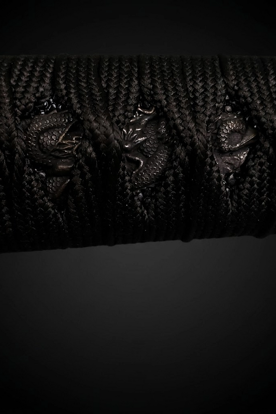 Close-up of black katana tsuka- Guild Arms.