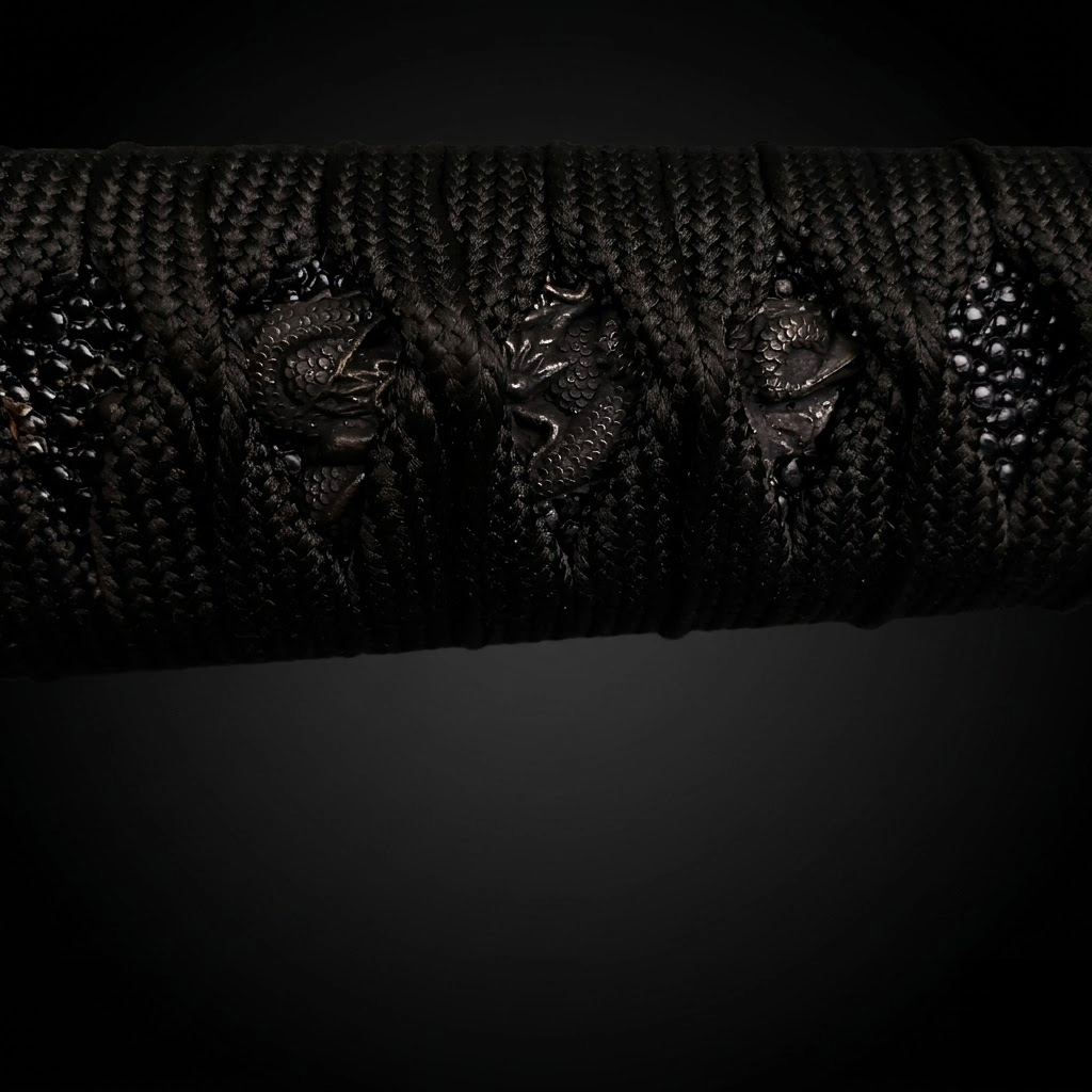 Close-up of black katana tsuka- Guild Arms.